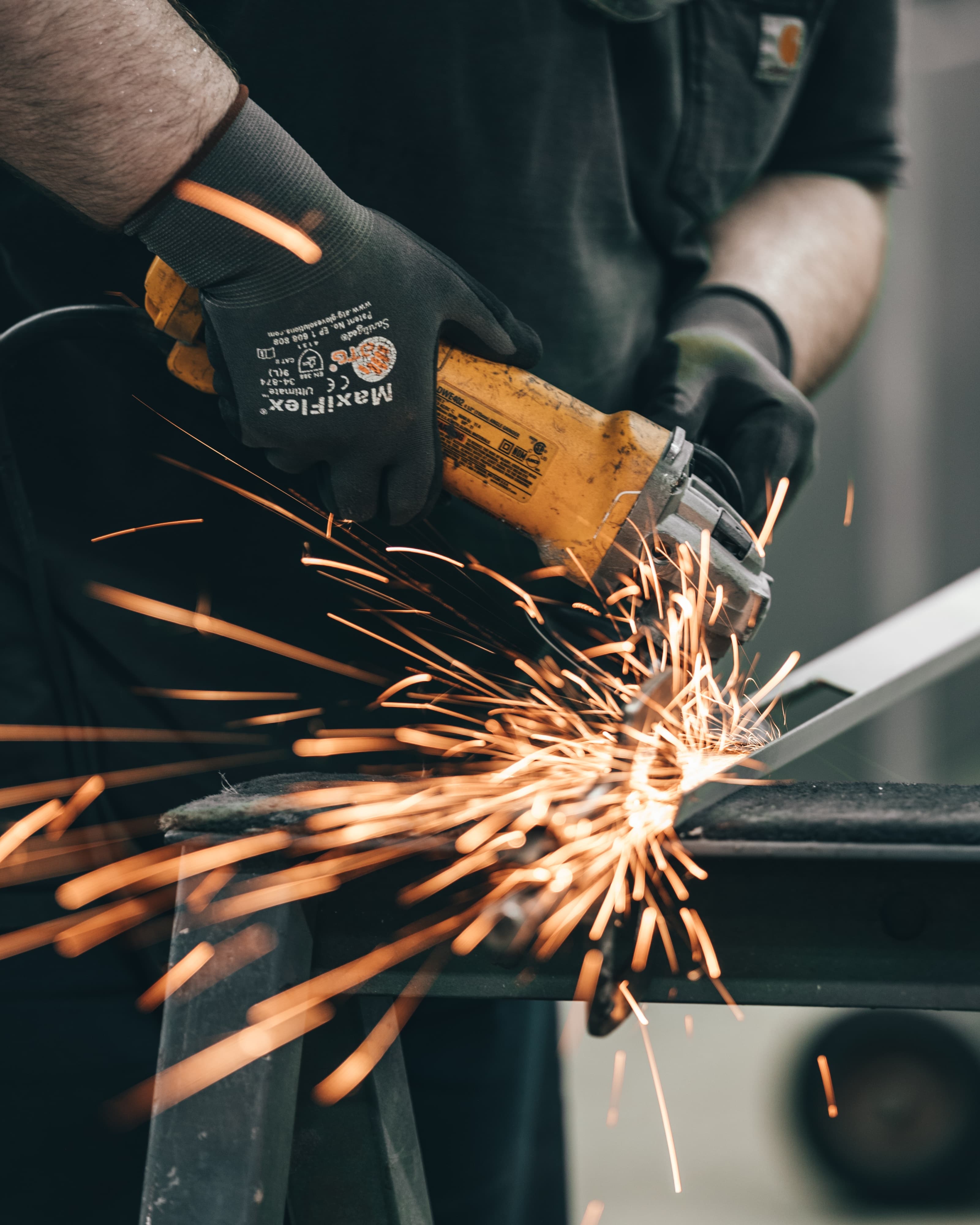 A guy grinding metal